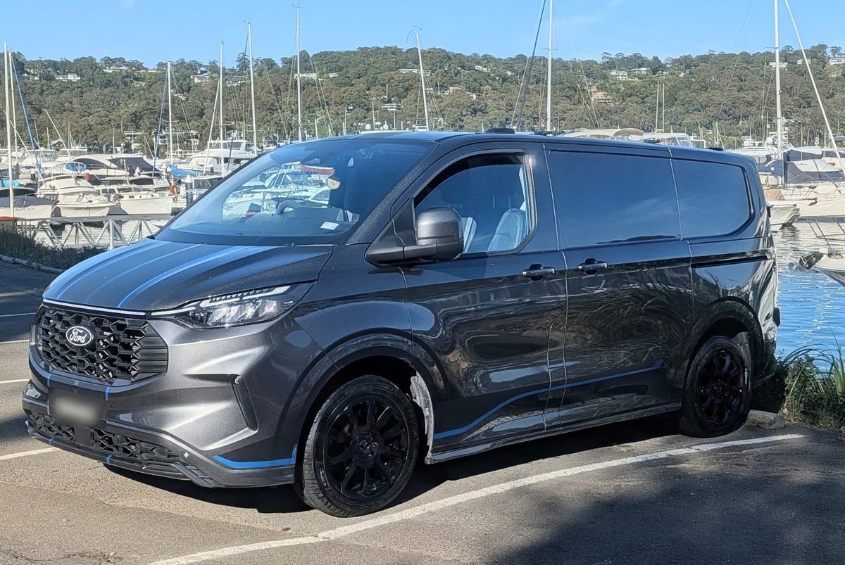 Botham Marine Electrical mobile service van parked beside a marina